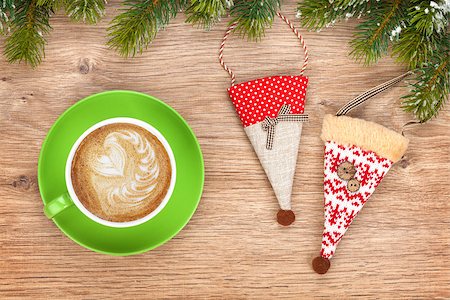 Christmas decor and coffee cup over wooden table background Stock Photo - Budget Royalty-Free & Subscription, Code: 400-07915230