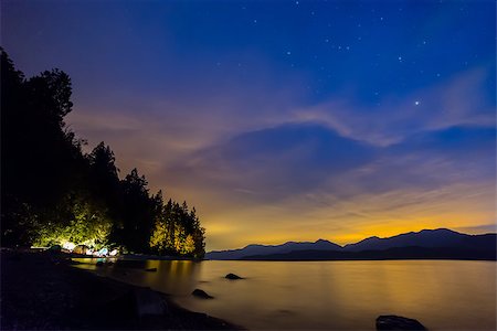Camping in tents next to lake with Blue and Orange night sky. Stock Photo - Budget Royalty-Free & Subscription, Code: 400-07916952