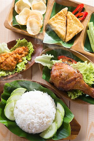 simsearch:400-07418409,k - Famous traditional Indonesian food. Delicious nasi ayam penyet with sambal belacan. Fried chicken rice. Stock Photo - Budget Royalty-Free & Subscription, Code: 400-07917695