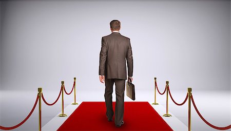 empty suitcase - Businessman in suit holding briefcase and go forward on red carpet. Rear view. Business concept Stock Photo - Budget Royalty-Free & Subscription, Code: 400-07917746