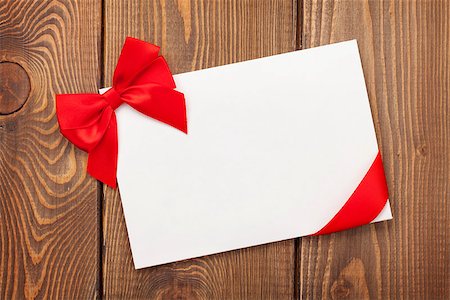 simsearch:400-07919385,k - Valentines day greeting card with red ribbon over wooden background Stock Photo - Budget Royalty-Free & Subscription, Code: 400-07919380