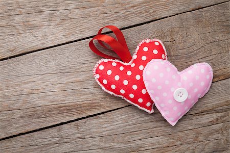 simsearch:400-07919385,k - Valentines day toy hearts over wooden table background with copy space Stock Photo - Budget Royalty-Free & Subscription, Code: 400-07925290