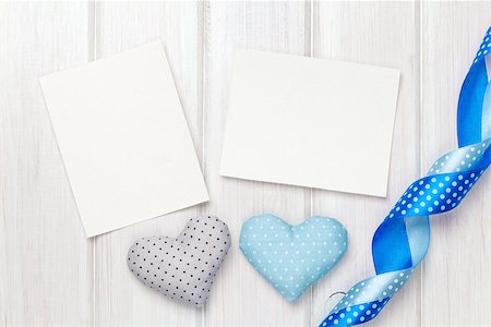 simsearch:400-07919385,k - Photo frames and valentines toy hearts over wooden table background Stock Photo - Budget Royalty-Free & Subscription, Code: 400-07925314