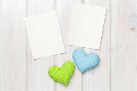 simsearch:400-07919385,k - Photo frames and valentines toy hearts over wooden table background Stock Photo - Budget Royalty-Free & Subscription, Code: 400-07925315