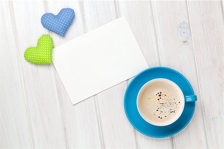 simsearch:400-07919385,k - Valentines day toy heart, blank greeting card and coffee cup over wooden table background Stock Photo - Budget Royalty-Free & Subscription, Code: 400-07925316