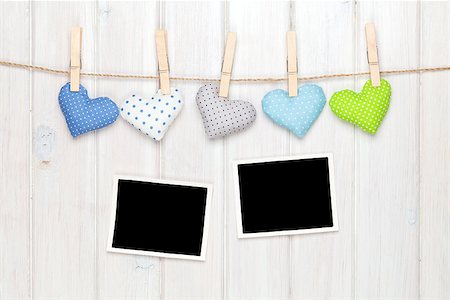 simsearch:400-07919385,k - Photo frames and valentines toy hearts over wooden background Stock Photo - Budget Royalty-Free & Subscription, Code: 400-07925327