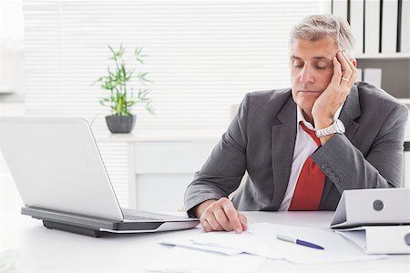 Tired businessman falling asleep at desk in his office Stock Photo - Budget Royalty-Free & Subscription, Code: 400-07927919
