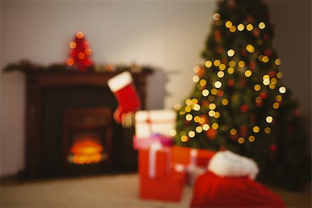 Christmas tree with presents near the fireplace at home in the living room Stock Photo - Budget Royalty-Free & Subscription, Code: 400-07928661