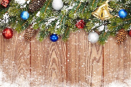Christmas wooden background with snow fir tree, decor and copy space Stock Photo - Budget Royalty-Free & Subscription, Code: 400-07921381