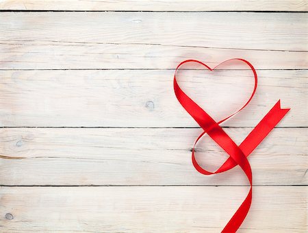 simsearch:400-07919385,k - Valentines day background with heart shaped ribbon over white wooden table background Stock Photo - Budget Royalty-Free & Subscription, Code: 400-07921431