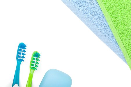 simsearch:400-05370670,k - Toothbrushes, soap and two towels. Isolated on white background Stock Photo - Budget Royalty-Free & Subscription, Code: 400-07922786