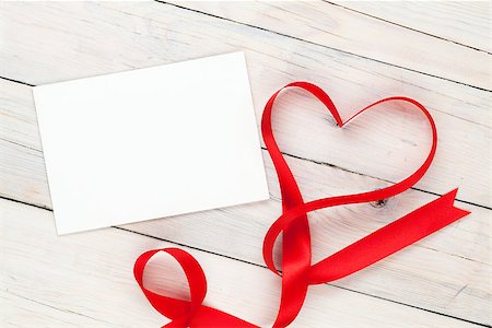 simsearch:400-07919385,k - Photo frame or greeting card with valentines heart shaped ribbon over wooden table background Stock Photo - Budget Royalty-Free & Subscription, Code: 400-07922858