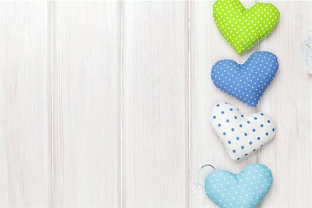 simsearch:400-07919385,k - Valentines day toy hearts over white wooden background with copy space Stock Photo - Budget Royalty-Free & Subscription, Code: 400-07922895