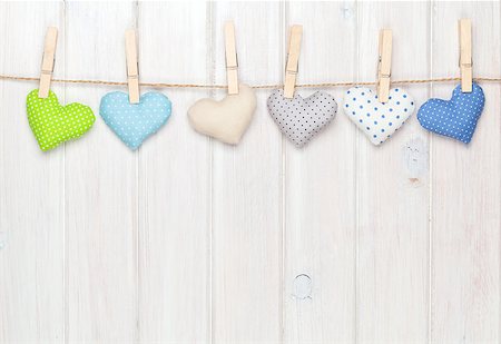 simsearch:400-07919385,k - Valentines day toy hearts hanging on rope over white wooden background with copy space Stock Photo - Budget Royalty-Free & Subscription, Code: 400-07922904