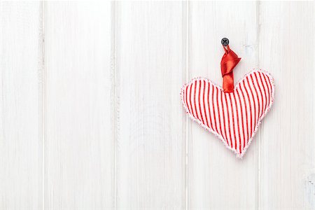 simsearch:400-07919385,k - Valentines day toy heart hanging over white wooden background with copy space Stock Photo - Budget Royalty-Free & Subscription, Code: 400-07922900