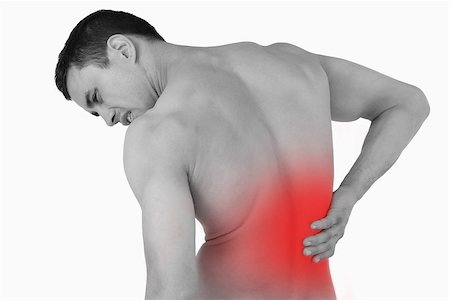 Back view of male suffering from back pain against a white background Stock Photo - Budget Royalty-Free & Subscription, Code: 400-07934220