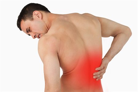 Back view of male suffering from back pain against a white background Stock Photo - Budget Royalty-Free & Subscription, Code: 400-07934288