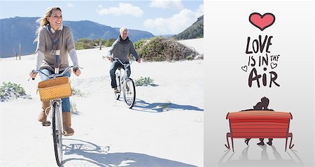 Carefree couple going on a bike ride on the beach against love is in the air Stock Photo - Budget Royalty-Free & Subscription, Code: 400-07935625