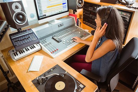 disc jockey radio - Smiling university student mixing audio in the studio of a radio Stock Photo - Budget Royalty-Free & Subscription, Code: 400-07939616