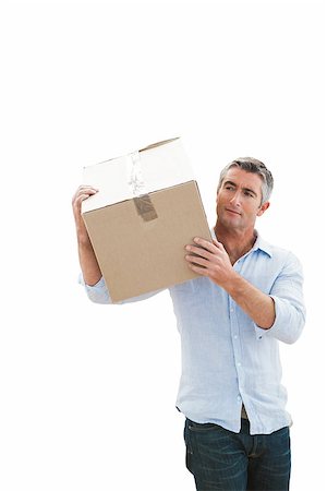 simsearch:400-07930718,k - Cheerful man carrying cardboard box on white background Stock Photo - Budget Royalty-Free & Subscription, Code: 400-07930716