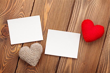 simsearch:400-07919385,k - Photo frames and handmaded valentines day toy hearts over wooden background Stock Photo - Budget Royalty-Free & Subscription, Code: 400-07933756