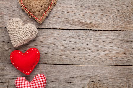 simsearch:400-07919385,k - Valentines day background with handmade toy hearts over wooden table Stock Photo - Budget Royalty-Free & Subscription, Code: 400-07933762