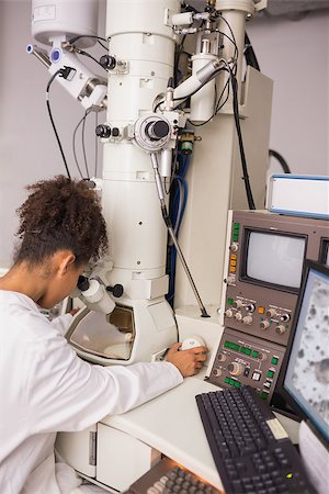 simsearch:649-07118434,k - Biochemistry students using large microscope and computer at the university Stock Photo - Budget Royalty-Free & Subscription, Code: 400-07940226