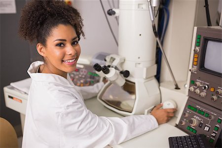 simsearch:649-07118434,k - Biochemistry student using large microscope at the university Stock Photo - Budget Royalty-Free & Subscription, Code: 400-07940227