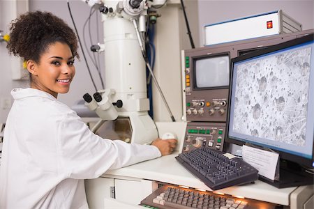 simsearch:649-07118434,k - Biochemistry student using large microscope and computer at the university Stock Photo - Budget Royalty-Free & Subscription, Code: 400-07940229