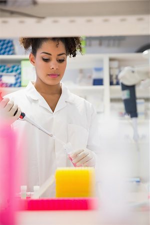 simsearch:649-07118434,k - Pretty science student using pipette at the university Stock Photo - Budget Royalty-Free & Subscription, Code: 400-07940284