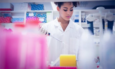 simsearch:649-07118434,k - Pretty science student using pipette at the university Stock Photo - Budget Royalty-Free & Subscription, Code: 400-07940285
