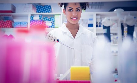 simsearch:649-07118434,k - Pretty science student using pipette at the university Stock Photo - Budget Royalty-Free & Subscription, Code: 400-07940286