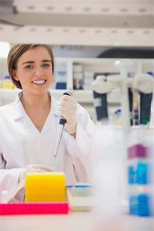 simsearch:649-07118434,k - Pretty science student using pipette at the university Stock Photo - Budget Royalty-Free & Subscription, Code: 400-07940287