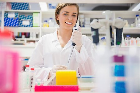 simsearch:649-07118434,k - Pretty science student using pipette at the university Stock Photo - Budget Royalty-Free & Subscription, Code: 400-07940288