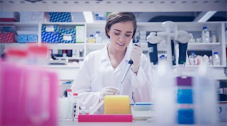 simsearch:649-07118434,k - Pretty science student using pipette at the university Stock Photo - Budget Royalty-Free & Subscription, Code: 400-07940289
