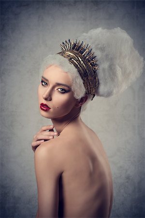 cute artistic portrait of stunning woman with crazy hair-style and golden accessories, stylish make-up romantic fashion pose Stock Photo - Budget Royalty-Free & Subscription, Code: 400-07954999