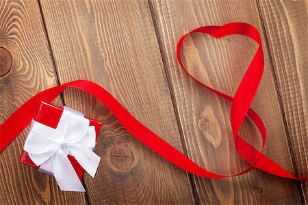 simsearch:400-07919385,k - Heart shape ribbon and gift box over wood valentines day background with copy space Stock Photo - Budget Royalty-Free & Subscription, Code: 400-07955446