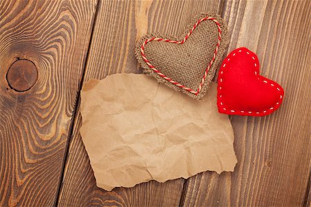 simsearch:400-07919385,k - Blank old piece of paper and vintage handmaded valentines day toy hearts over wooden background Stock Photo - Budget Royalty-Free & Subscription, Code: 400-07955899