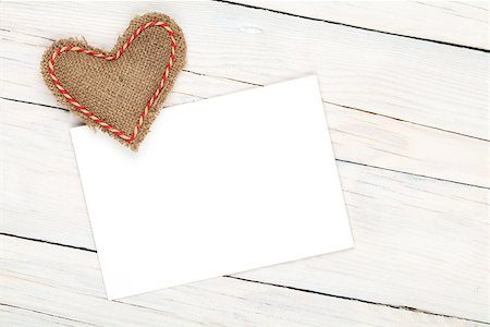simsearch:400-07919385,k - Photo frame or greeting card and handmaded valentines day toy heart over white wooden background Stock Photo - Budget Royalty-Free & Subscription, Code: 400-07955903