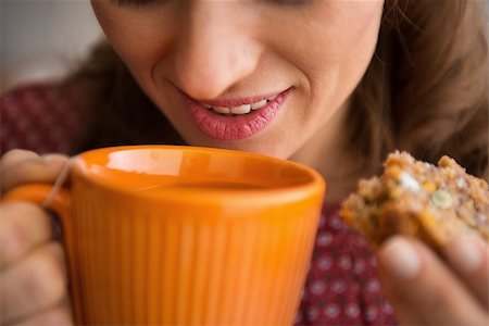 Closeup on young housewife drinking tea with freshly baked pumpkin bread with seeds Stock Photo - Budget Royalty-Free & Subscription, Code: 400-07956865