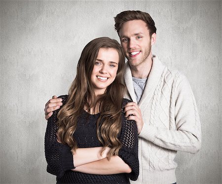 simsearch:400-07957355,k - Portrait of smiling young couple against weathered surface Stock Photo - Budget Royalty-Free & Subscription, Code: 400-07957352