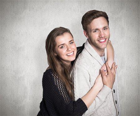 simsearch:400-07957355,k - Portrait of happy young couple against weathered surface Stock Photo - Budget Royalty-Free & Subscription, Code: 400-07957353