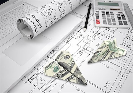 shadow plane - Paper airplanes of dollars lying on architectural drawings. Laptop and tools are close by. Concept of building business Stock Photo - Budget Royalty-Free & Subscription, Code: 400-07951451