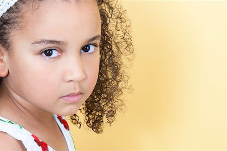 sad african children - A beautiful mixed race African American little girl female child looking sad and sulking Stock Photo - Budget Royalty-Free & Subscription, Code: 400-07975564