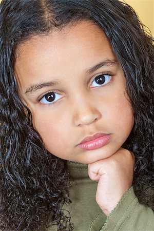 sad african children - A beautiful mixed race African American little girl female child looking sad and sulking Stock Photo - Budget Royalty-Free & Subscription, Code: 400-07975561