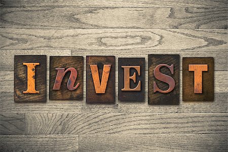 simsearch:400-05730304,k - The word "INVEST" written in wooden letterpress type. Stock Photo - Budget Royalty-Free & Subscription, Code: 400-07977882