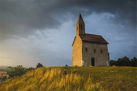 st michael - Old Roman Catholic Church of St. Michael the Archangel on the Hill at Sunset in Drazovce, Slovakia Stock Photo - Budget Royalty-Free & Subscription, Code: 400-07979581