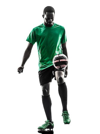 one african man soccer player green jersey juggling in silhouette on white background Stock Photo - Budget Royalty-Free & Subscription, Code: 400-07973117