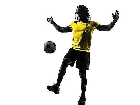 one black Brazilian soccer football player man in silhouette studio on white background Stock Photo - Budget Royalty-Free & Subscription, Code: 400-07973190