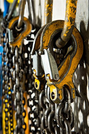 shackle - Several large industrial weathered yellow hooks attached to chain and a pulley. Stock Photo - Budget Royalty-Free & Subscription, Code: 400-07973610